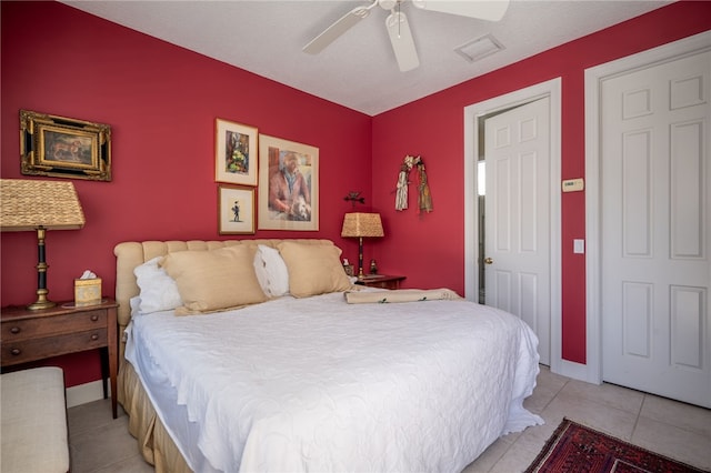 bedroom featuring ceiling fan and light tile patterned flooring