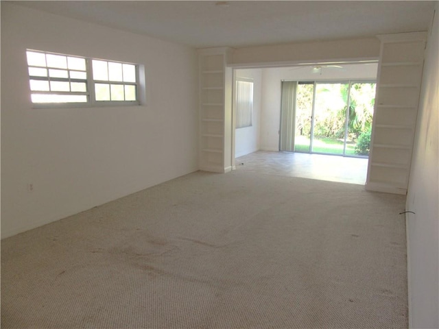 720 Lake Orchid Cir Unit 108, Vero Beach, FL 32962 - carpeted empty room featuring healthy amount of natural light