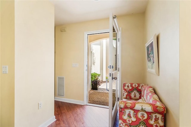 8409 Red Bay Ct Unit 8409, Vero Beach, FL 32963 - living area featuring visible vents, baseboards, and wood finished floors