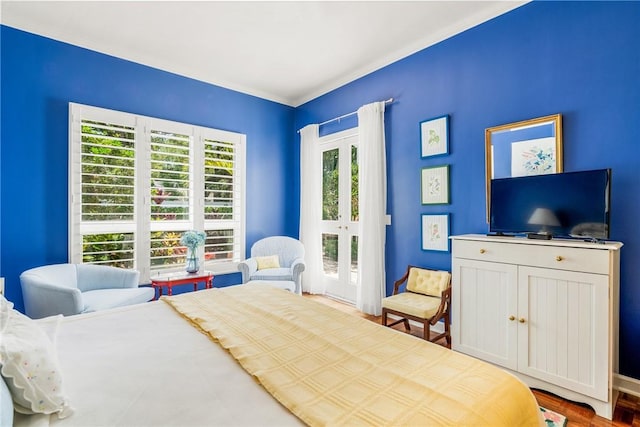 8409 Red Bay Ct Unit 8409, Vero Beach, FL 32963 - bedroom featuring french doors, wood finished floors, and access to exterior