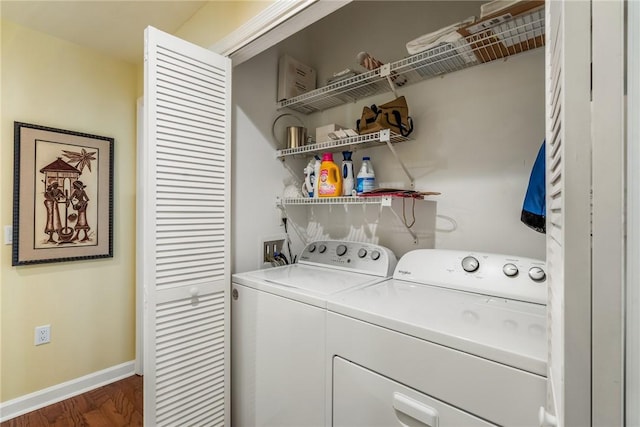 8409 Red Bay Ct Unit 8409, Vero Beach, FL 32963 - clothes washing area featuring washer and dryer, laundry area, baseboards, and dark wood finished floors