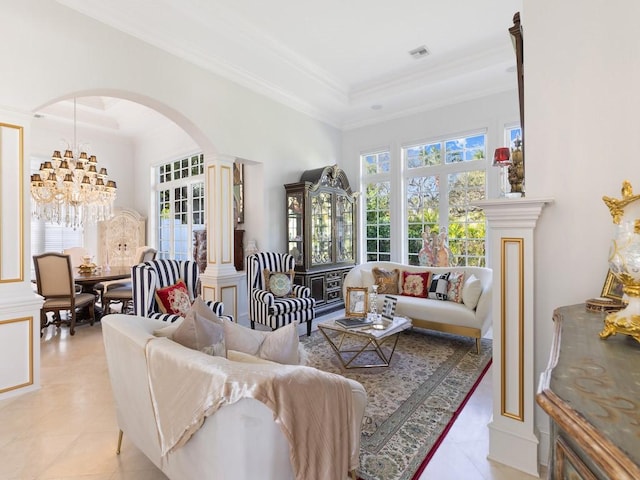 7 Beachside Dr, Vero Beach, FL 32963 - living area with decorative columns, an inviting chandelier, arched walkways, ornamental molding, and light tile patterned flooring