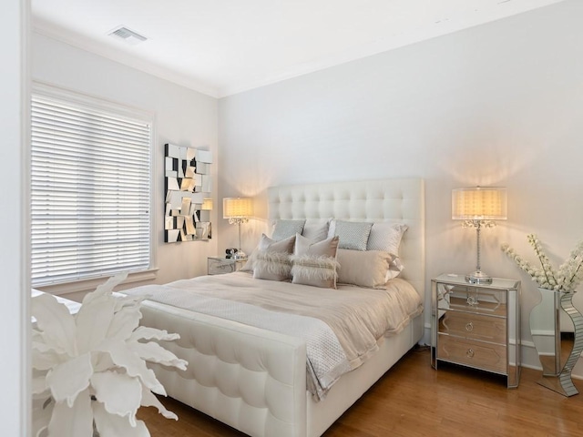 7 Beachside Dr, Vero Beach, FL 32963 - bedroom featuring visible vents and wood finished floors