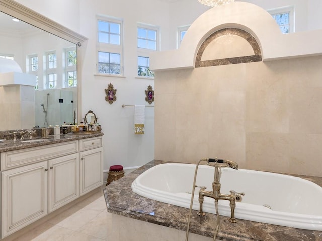 7 Beachside Dr, Vero Beach, FL 32963 - bathroom featuring a bath, plenty of natural light, vanity, and walk in shower