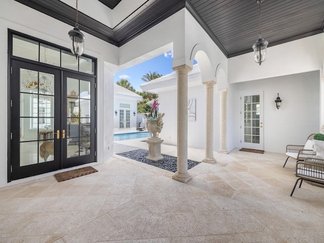 7 Beachside Dr, Vero Beach, FL 32963 - view of patio / terrace featuring an outdoor pool and french doors