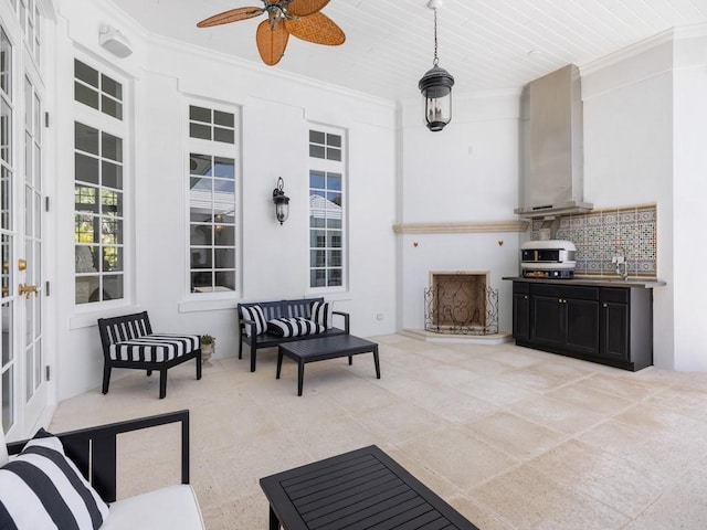 7 Beachside Dr, Vero Beach, FL 32963 - view of patio / terrace with a fireplace with raised hearth, a ceiling fan, and french doors