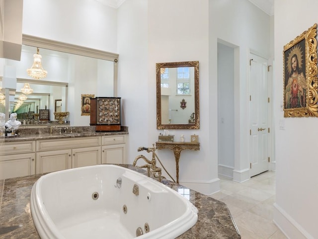 7 Beachside Dr, Vero Beach, FL 32963 - full bathroom with ornamental molding, a sink, a whirlpool tub, tile patterned floors, and baseboards