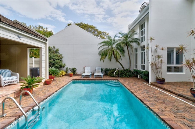 pool with a patio area