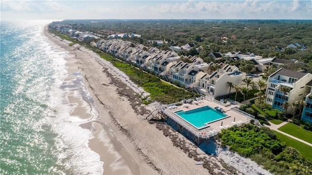 aerial view with a water view and a view of the beach