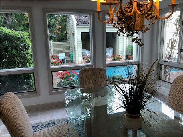 dining room featuring baseboards and tile patterned floors