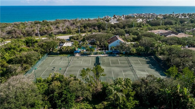 exterior space featuring a water view and fence