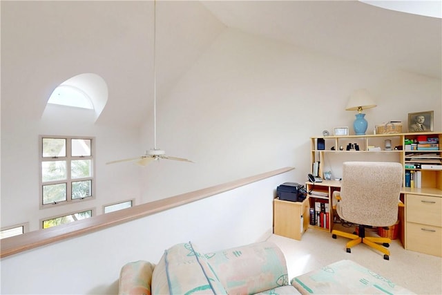 carpeted office space with high vaulted ceiling