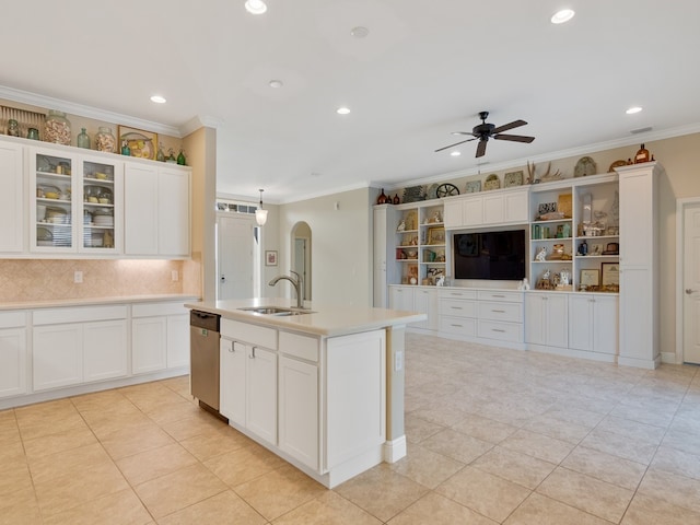 kitchen with a kitchen island with sink, sink, dishwasher, and white cabinets