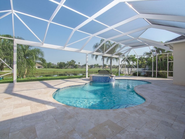 view of swimming pool featuring pool water feature, glass enclosure, a patio, and an in ground hot tub