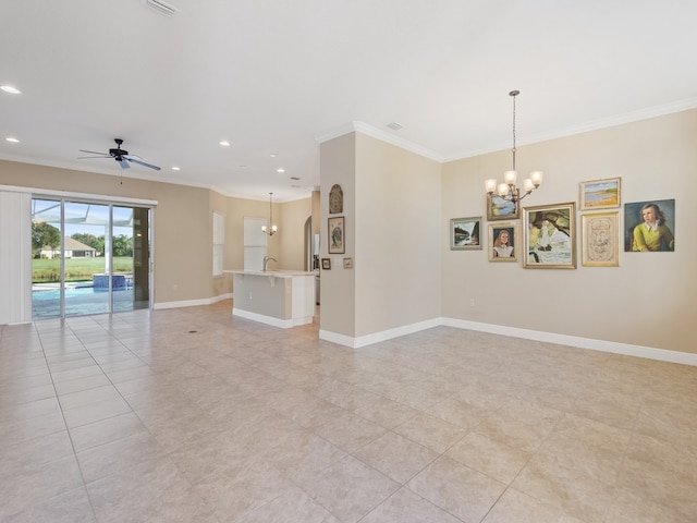 spare room featuring ceiling fan with notable chandelier, light tile patterned floors, sink, and ornamental molding