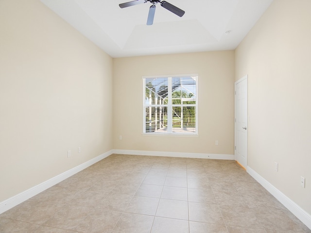 tiled empty room with ceiling fan