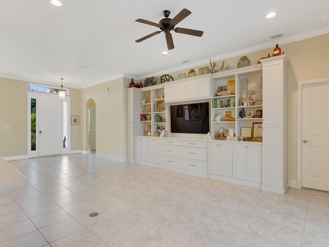 unfurnished living room featuring light tile patterned flooring, ceiling fan, and ornamental molding