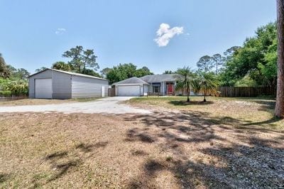 ranch-style house featuring a garage