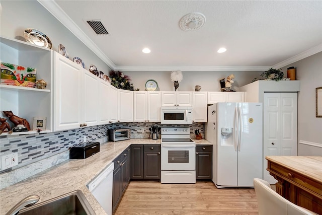 kitchen featuring white cabinets, light wood-type flooring, white appliances, and ornamental molding