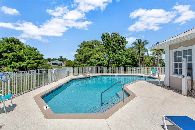 view of swimming pool featuring a patio area