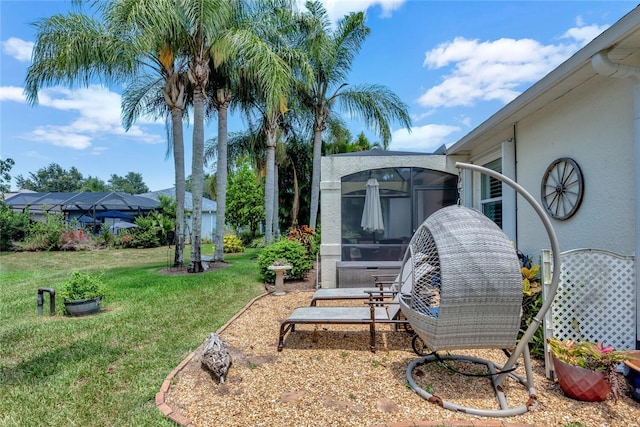 view of yard featuring a sunroom