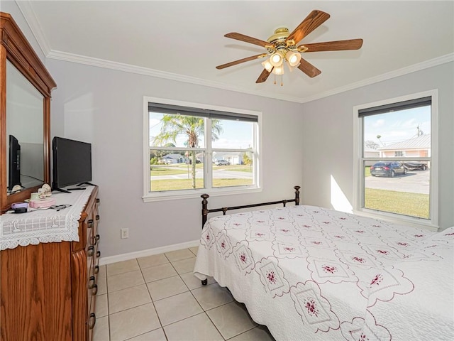 tiled bedroom with ceiling fan and ornamental molding