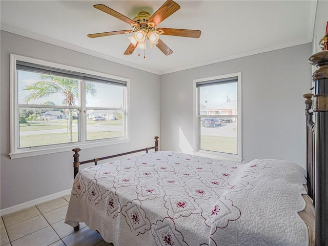 tiled bedroom with ceiling fan and ornamental molding