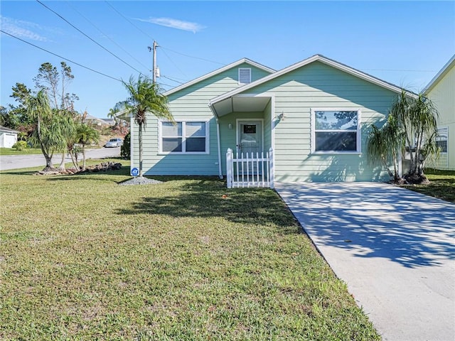 bungalow-style house with a front lawn