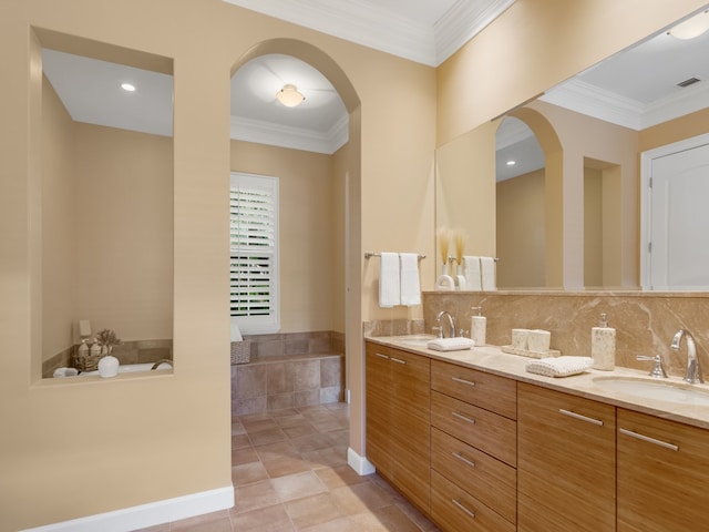 bathroom with vanity, decorative backsplash, tile patterned floors, and crown molding