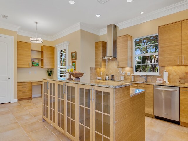 kitchen with wall chimney exhaust hood, plenty of natural light, a center island, pendant lighting, and dishwasher