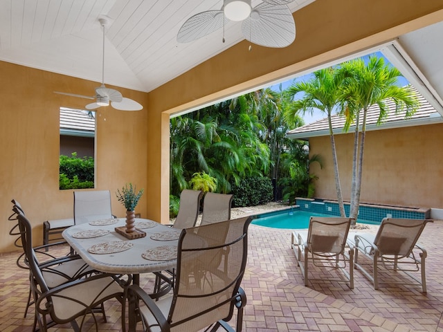 9082 Castle Harbour Cir, Vero Beach, FL 32963 - view of patio with ceiling fan, an outdoor pool, and outdoor dining area