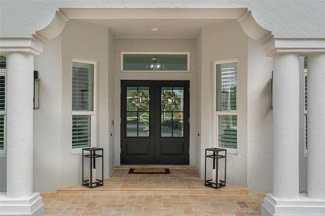 entrance to property featuring french doors