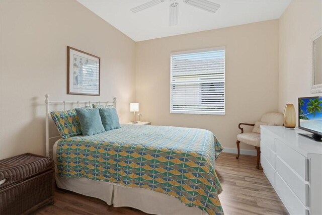 bedroom with hardwood / wood-style flooring and ceiling fan