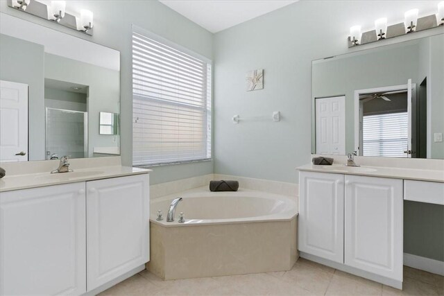 bathroom featuring plenty of natural light, shower with separate bathtub, and vanity