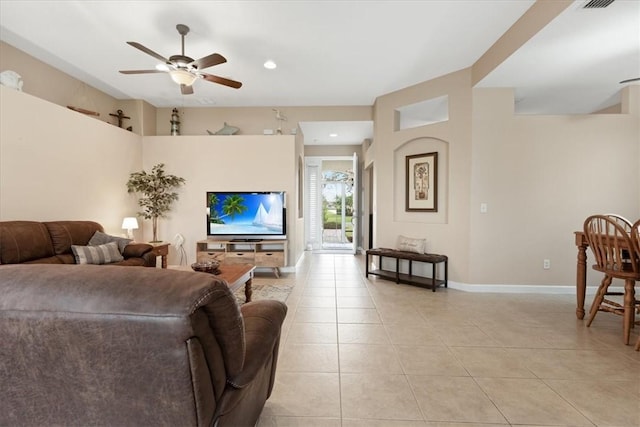 tiled living room featuring ceiling fan