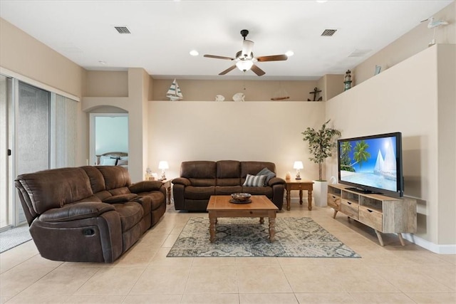 living room with ceiling fan and light tile patterned floors