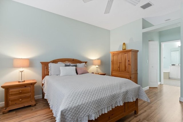 bedroom featuring ceiling fan, connected bathroom, and light hardwood / wood-style flooring