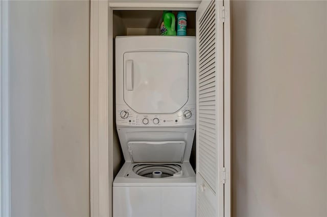 5075 Harmony Cir Unit 302, Vero Beach, FL 32967 - washroom featuring estacked washer and dryer