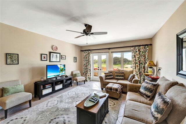 living room featuring french doors, ceiling fan, and light tile patterned floors