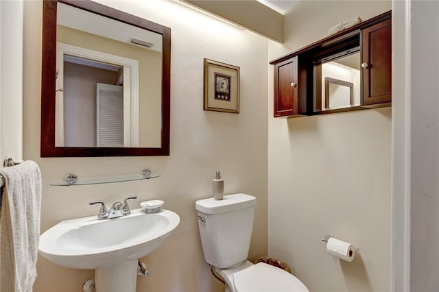 bathroom with sink and toilet