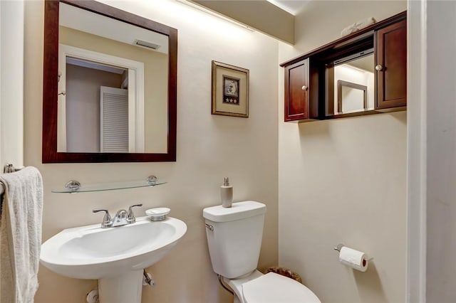 5075 Harmony Cir Unit 302, Vero Beach, FL 32967 - bathroom with toilet and a sink