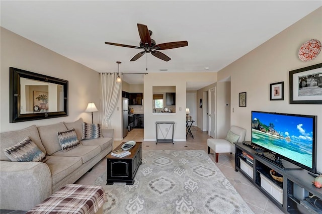 5075 Harmony Cir Unit 302, Vero Beach, FL 32967 - living area featuring a ceiling fan and light tile patterned flooring