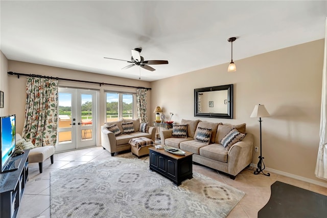 living room with ceiling fan, light tile patterned floors, and french doors