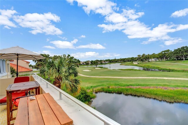 view of property's community featuring a water view and a yard