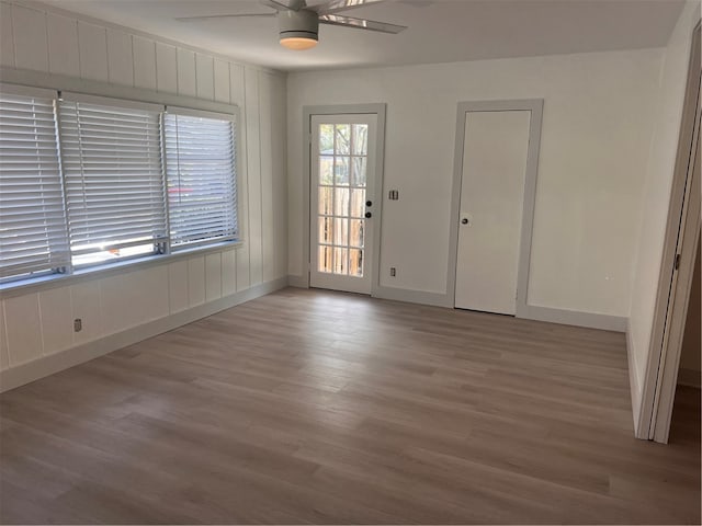 unfurnished room featuring light wood-type flooring and ceiling fan