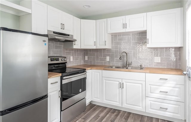 kitchen with stainless steel appliances, white cabinetry, and sink