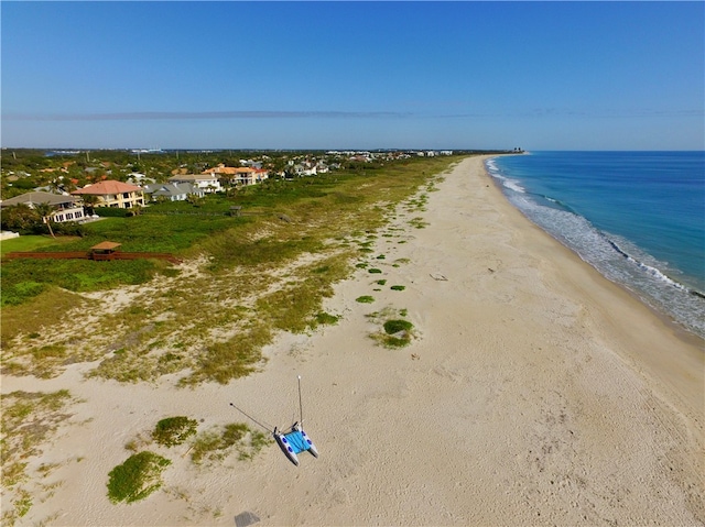 aerial view featuring a view of the beach and a water view