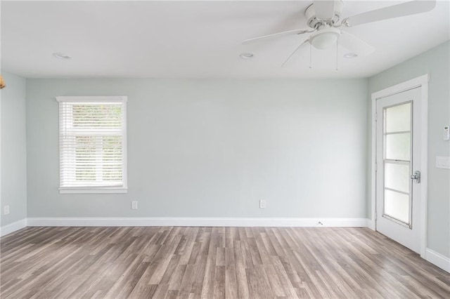 unfurnished room with light hardwood / wood-style flooring and ceiling fan