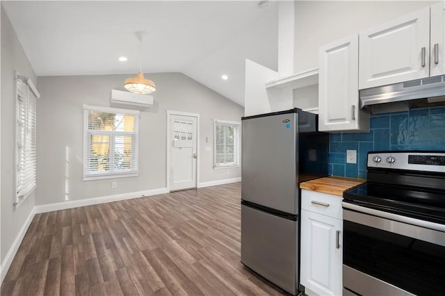 kitchen with a wall unit AC, stainless steel appliances, butcher block counters, hardwood / wood-style floors, and white cabinetry