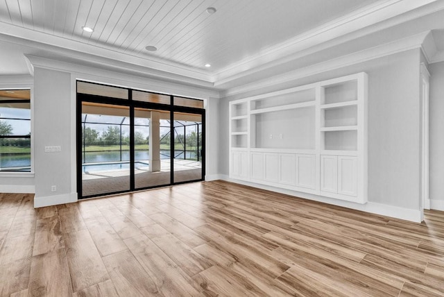 unfurnished room with a water view, light hardwood / wood-style flooring, wooden ceiling, ornamental molding, and built in features